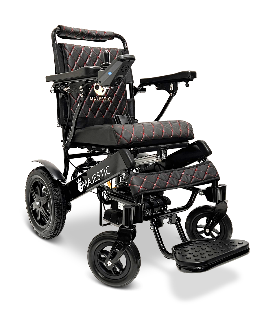 The ComfyGo MAJESTIC IQ-9000 Auto Reclining Electric Wheelchair features a black and red foldable design, padded seat/backrest, armrests, footrest, large rear wheels, digital joystick controller, aircraft-grade aluminum frame, and Majestic logo on the side.